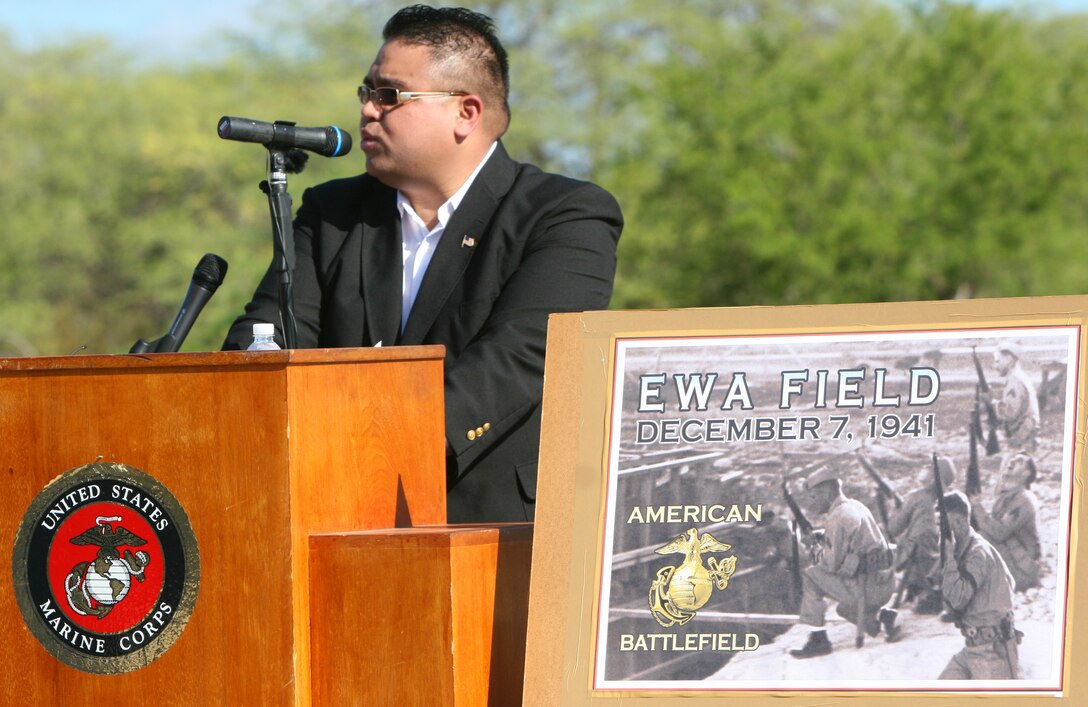 Reverend Danny Degracia kicks off the first Marine Corps Air Station Ewa Memorial Dec. 6 at what remains of Ewa Field. MCAS Ewa could be the spot where U.S. service members first fired during WWII, according to John Bond, the event coordinator and avid WWII historian. Degracia served as the master of ceremonies. (Official U.S. Marine Corps photo by Sgt. Juan D. Alfonso) (Released)