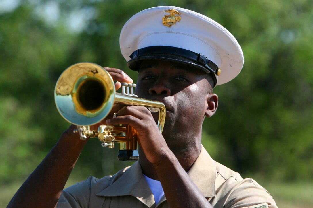 Cpl. Marcus Smith plays Taps to recognize the four Marines who lost their lives at Marine Corps Air Station Ewa Memorial during the Pearl Harbor attacks Dec 6 at what remains of Ewa field. MCAS Ewa could be the spot where U.S. service members first fired during WWII, according to John Bond, the event coordinator and avid WWII historian. Smith is a Musician with the U.S. Marine Forces, Pacific Band. (Official U.S. Marine Corps photo by Sgt. Juan D. Alfonso) (Released)
