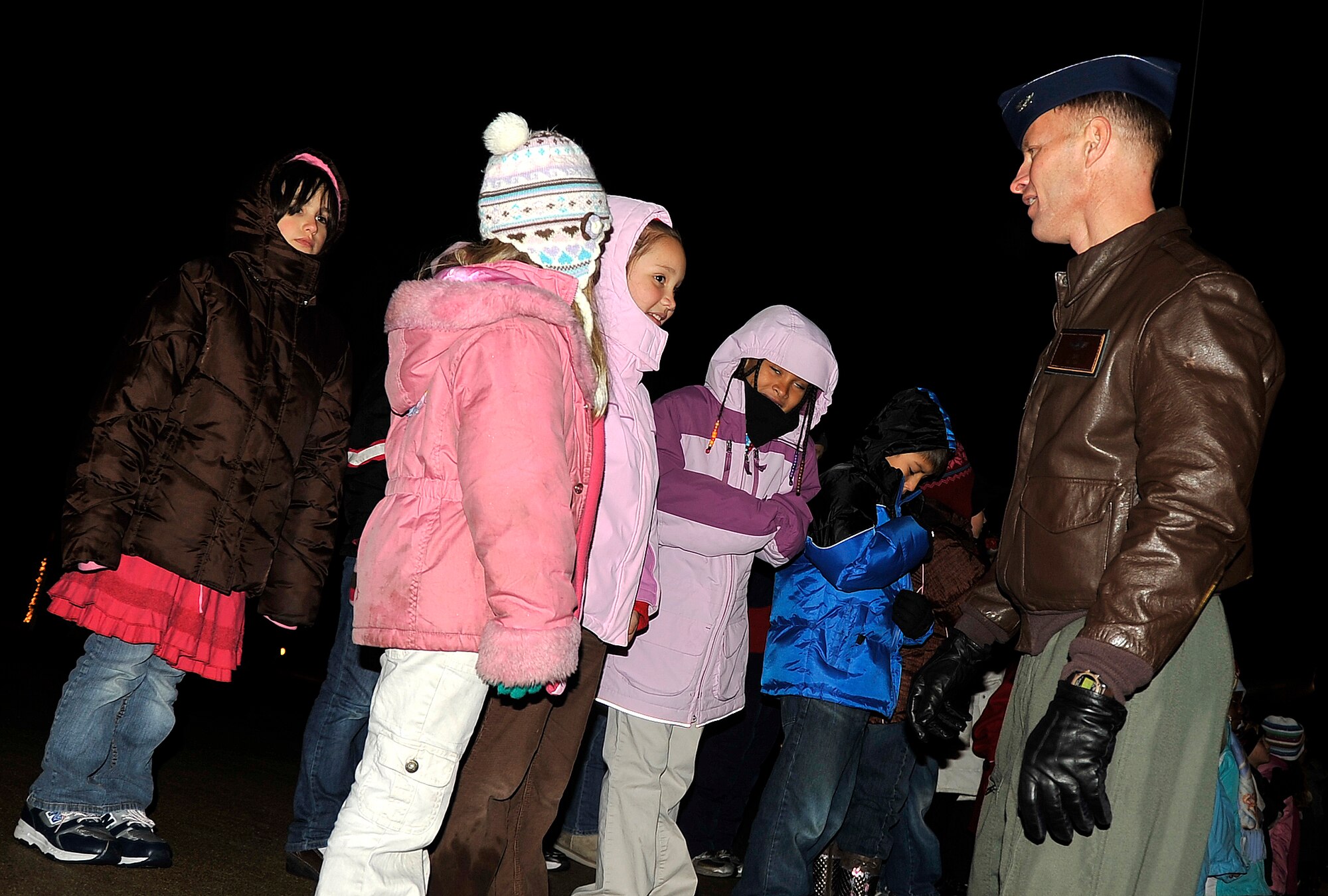 MISAWA AIR BASE, Japan -- Col. RC Craig, 35th Fighter Wing vice commander, speaks with Sollars Elementary School 3rd graders before their musical performance during the Tree Lighting Ceremony Dec. 4 at Risner Circle. The Edgren High School choir also performed two Christmas carols. (U.S. Air Force photo/Staff Sgt. Chad C. Strohmeyer)