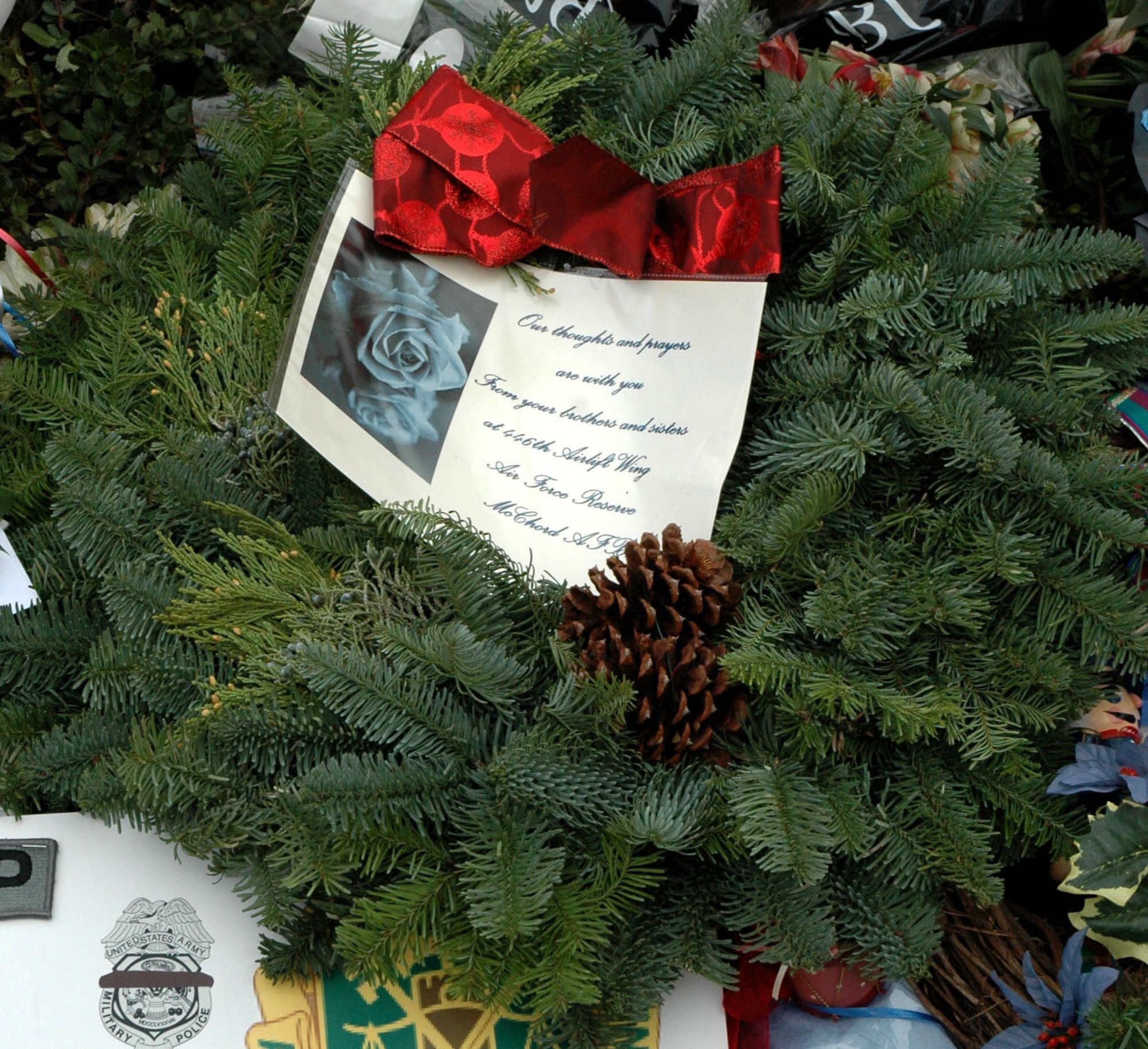 LAKEWOOD, Wash. - Reservists with the 446th Security Forces Squadron, McChord Air Force Base, Wash., left this wreath at the memorial site located at the Lakewood Police Department, Dec. 6. The group of 446th SFS police officers rendered a salute and had a moment of silence to honor their fellow police officers who were killed on Nov. 29. (U.S. Air Force photo/Staff Sgt. Nicole Celestine).