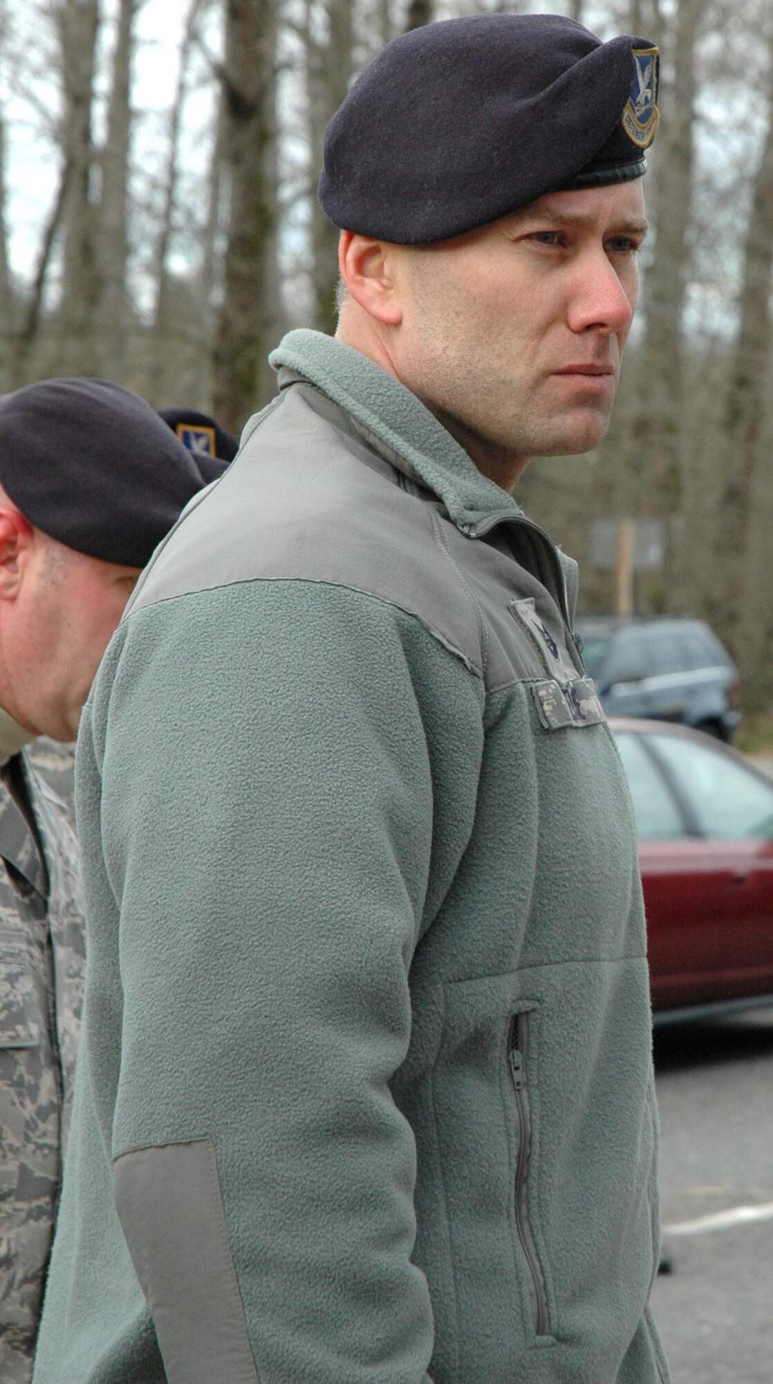 LAKEWOOD, Wash. - Tech. Sgt. Christopher Pierce with 446th Security Forces Squadron, is in deep thought while he visits the memorial site located outside the Lakewood Police Station, Dec. 6. Pierce and other Reservists with the 446th SFS, McChord Air Force Base, Wash., paid their respects to the four police officers who were murdered at a local coffee shop on Nov. 29.  (U.S. Air Force photo/Staff Sgt. Nicole Celestine). 