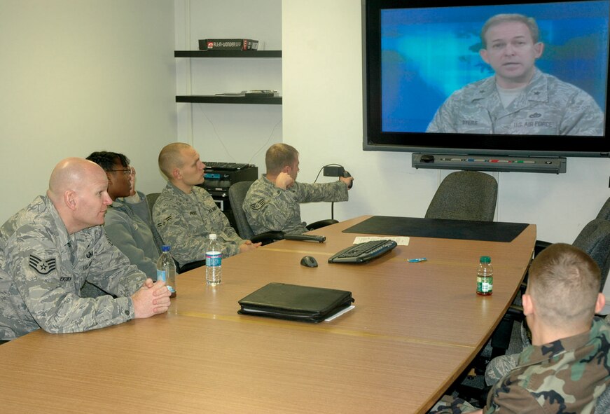 MCCHORD AIR FORCE BASE, Wash.- Reservists from the 446th Civil Engineer Squadron's Explosive Ordnance Flight here watch a videotaped message from Brig. Gen. Timothy Byers during their EOD Safety Day here, Dec. 6. The second annual event was conducted to augment their traditional training with a focus on the physical and mental health of EOD technicians, and to emphasize the critical importance of EOD operations. (U.S. Air Force photo/Staff Sgt. Grant Saylor)