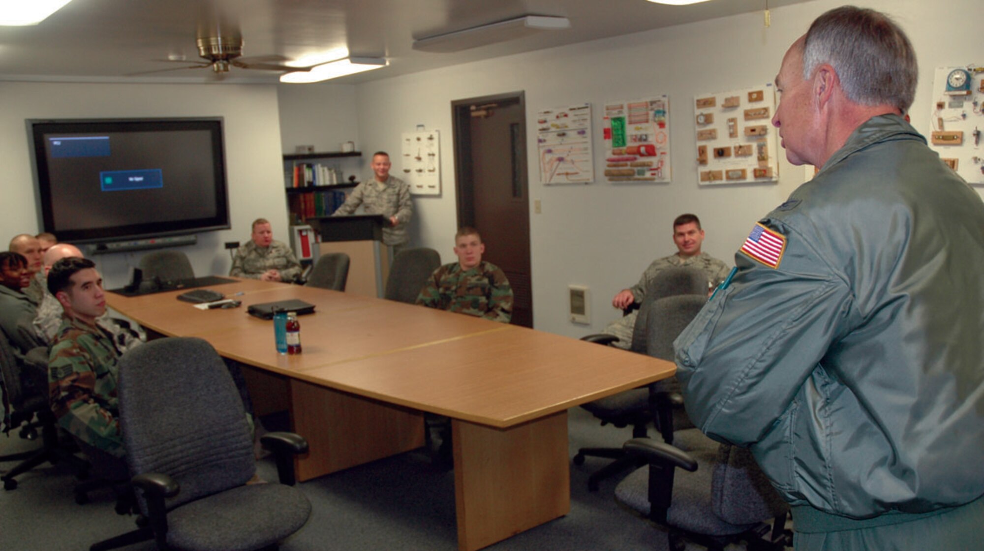 McCHORD AIR FORCE BASE, Wash.- Col. William Flanigan, 446th Airlift Wing commander here, speaks to Reservists from the 446th Civil Engineer Squadron's Explosive Ordnance Flight during their EOD Safety Day here, Dec. 6. The second annual event was conducted to augment traditional training with a focus on the physical and mental health of EOD technicians, and to emphasize the critical importance of EOD operations. (U.S. Air Force photo/Staff Sgt. Grant Saylor)