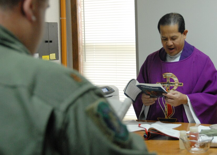 Father (Capt.) Elbert Fadallan, 1st Special Operations Wing, administers a Catholic Mass to 919th Special Operations Wing reservists at Duke Field Dec. 6.  This is the first official catholic mass held for a UTA at Duke Field.  Father Fadallan spoke to his small congregation about “names.”  A regular Catholic Mass will be held every UTA Sunday at 11:30 a.m.  (Air Force photo/Staff Sgt. Samuel King Jr.)