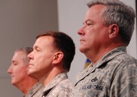 (Right to left) Col. Kenneth Honaker, Col. James Brock, and Col. Jon Weeks, 919th Special Operations Wing commander stand at attention during the National Anthem at the 919th Maintenance Group change of command ceremony Dec. 5.  Colonel Honaker assumed command from Colonel Brock.  (Air Force photo/Staff Sgt. Samuel King Jr.)