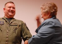 Newly promoted Chief Master Sgt. John Owens, 2nd Operations Squadron, receives the traditional “tack-on” from his mother Shirley Owens Dec. 5 at Duke Field.  Chief Owens and Chief Master Sgt. Doug McDavid, 711th Special Operations Squadron, were both inducted as chiefs Dec. 5.  The new chiefs’ date of rank (Dec. 1) is the same day as the 50th anniversary of the establishment of the chief master sergeant rank.  (Air Force photo/Staff Sgt. Samuel King Jr.)