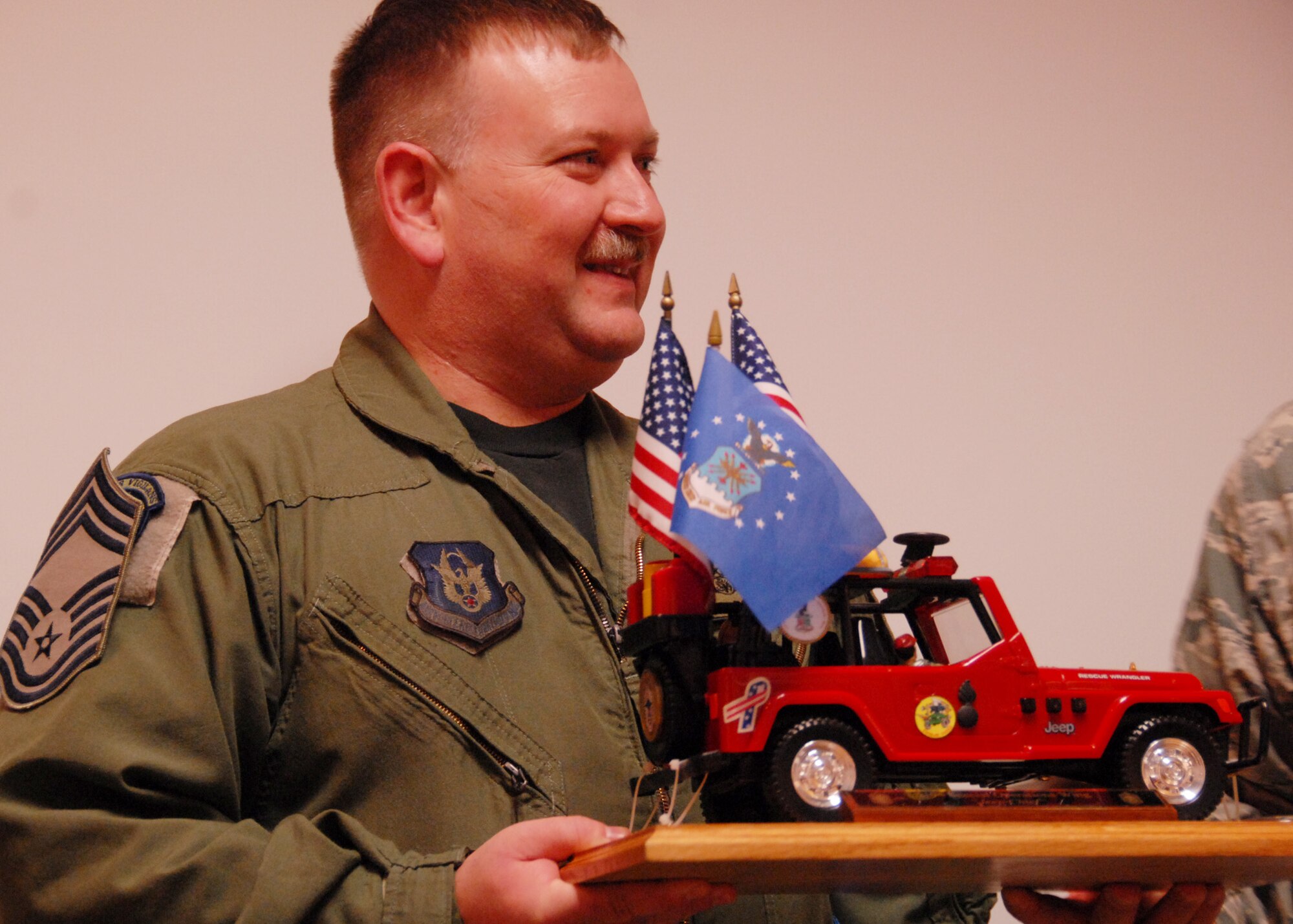 Chief Master Sgt. John Owens, 2nd Special Operations Squadron, accepts his position as the 919th Special Operations Wing’s newest “Jeep Chief.”  Chief Owens and Chief Master Sgt. Doug McDavid, 711th Special Operations Squadron, were both inducted as chiefs Dec. 5. The new chiefs’ date of rank (Dec. 1) is the same day as the 50th anniversary of the establishment of the chief master sergeant rank. (Air Force photo/Staff Sgt. Samuel King Jr.)