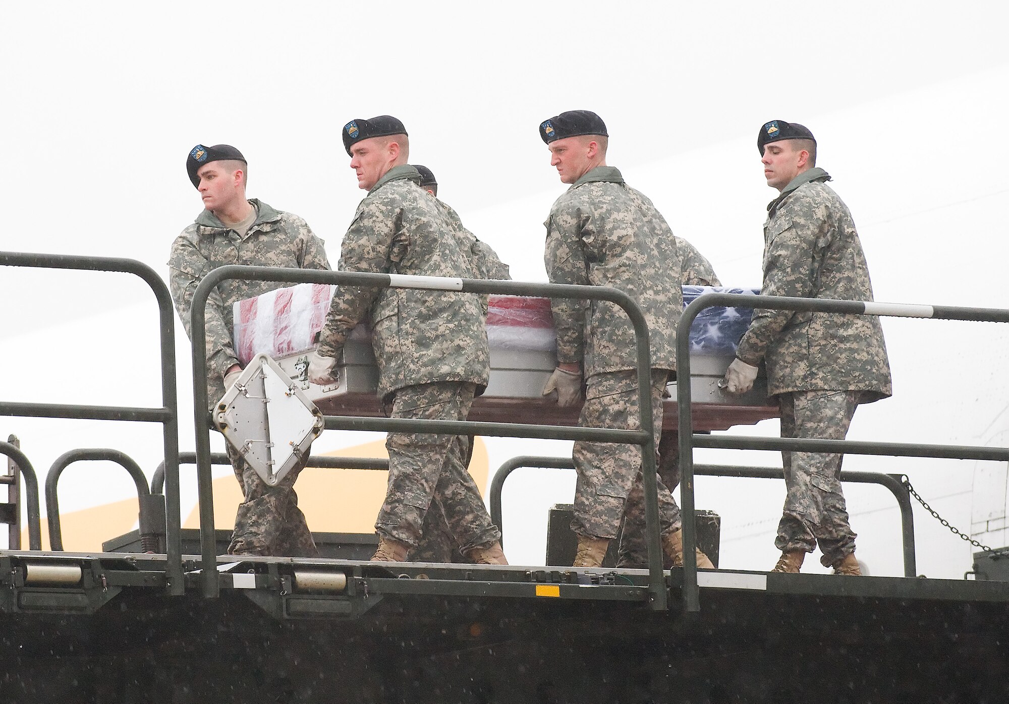 5 December 2009  USAF Photo by Jason Minto.  A U.S. Army carry team transfers the remains of Army Sergeant Brandon T. Islip., of Richmond, VA., at Dover Air Force Base, Del., Dec 5, 2009.  He was a member of the 1st Battalion, 508th Parachute Infantry Regiment, 4th Brigade Combat Team, 82nd Airborne Division, Fort Bragg, N.C. and went missing, Nov. 4, while involved in a resupply mission in Bala Murghab, Afghanistan. 