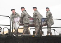5 December 2009  USAF Photo by Jason Minto.  A U.S. Army carry team transfers the remains of Army Sergeant Brandon T. Islip., of Richmond, VA., at Dover Air Force Base, Del., Dec 5, 2009.  He was a member of the 1st Battalion, 508th Parachute Infantry Regiment, 4th Brigade Combat Team, 82nd Airborne Division, Fort Bragg, N.C. and went missing, Nov. 4, while involved in a resupply mission in Bala Murghab, Afghanistan. 