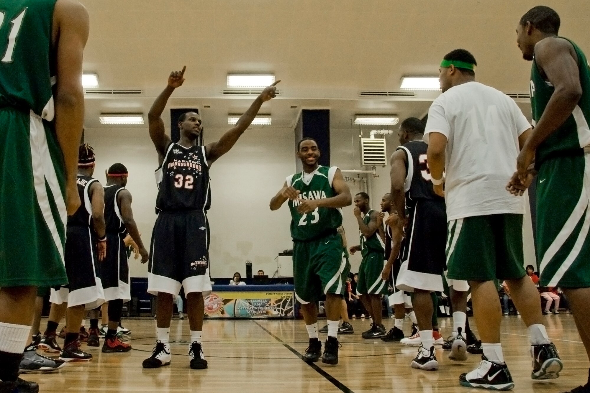 MISAWA AIR BASE, Japan -- Members of the Harlem Ambassadors and Misawa Jets dance during a brief intermission at the game Dec. 7 at the Potter Fitness Center. So far this month, the Harlem Ambassadors have performed at Atsugi, Camp Fuji and Yokosuka, Japan, with one more stop to Iwakuni, Japan, before heading back to the United States. (U.S. Air Force photo/Senior Airman Jamal D. Sutter)