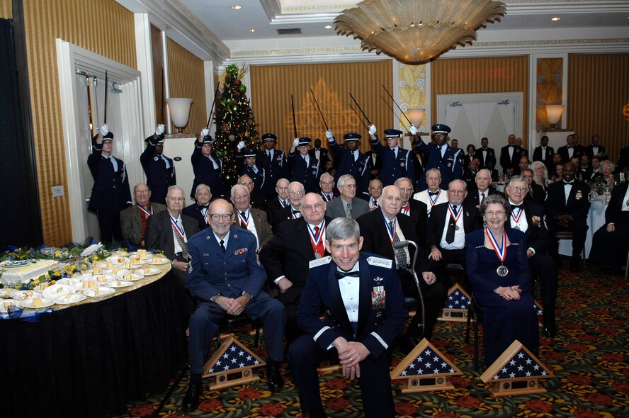 Gen. Norton Schwartz, Air Force Chief of Staff, pauses for a photo with 18 Charter Chiefs, the first Airmen promoted to the rank of chief master sergeant in the Air Force. Dec. 1 marked the 50th anniversary of their accomplishment. (U.S. Air Force photo by Senior Airman Ryan Ivacic)
