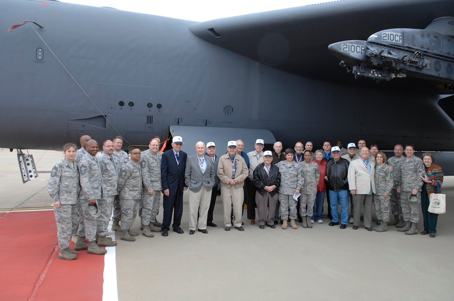 The Air Force Charter Chiefs pause for a photoin front of a B-52 during a base tour, Dec. 1. The tour was a part of of their golden anniversary celebration. Other events included stops at the Airmen Leadership School, a luncheon and a dinner in their honor. (U.S. Air Force photo by Senior Airman Ryan Ivacic)