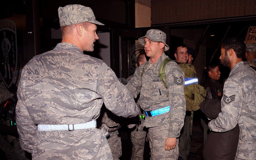 MOODY AIR FORCE BASE, Ga. -- (Left) Col. Gary Henderson, 23rd Wing commander, greets 41st Rescue Squadron Airmen who returned home after a three-month deployment here Dec. 4. Two groups of Airmen from the 41st RQS returned from various locations in Iraq and Afghanistan. (U.S. Air Force photo by Airman 1st Class Joshua Green) 