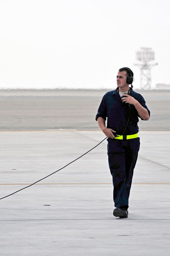 Senior Airman Adam Smith, 1st Fighter Wing crew chief, completes a last minute walk around Nov. 30, 2009, at an airfield in Southwest Asia. Airman Smith is participating in the Iron Falcon exercise while on temporary duty from Langley Air Force Base, Va. (U.S. Air Force photo/Tech. Sgt. Charles Larkin Sr)