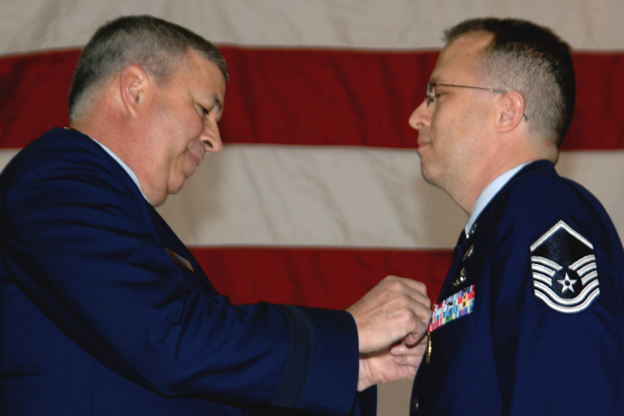 GRISSOM AIR RESERVE BASE, Ind., -- Brig. Gen. Dean Despinoy, 434th Air Refueling Wing commander, pins a Meritorious Service Medal onto Master Sgt. Wes Marion, legal office superintendent, during a wing commanders call.  (U.S. Air Force photo/Tech. Sgt. Doug Hays)