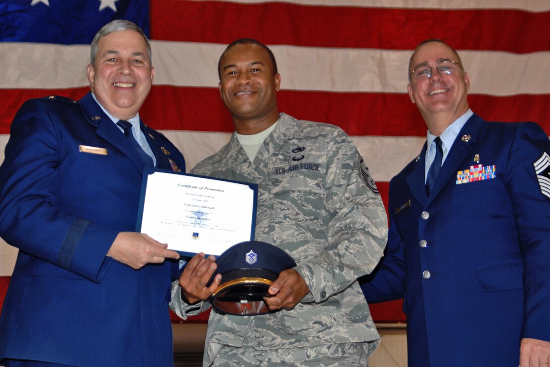 GRISSOM AIR RESERVE BASE, Ind., -- Brig. Gen. Dean Despinoy, 434th Air Refueling Wing commander, left, and Chief Master Sgt. Larry Brady, right, present a certificate to Master Sgt. Vincent Culbreath, a first sergeant with the 434th Mission Support Squadron, recognizing his induction into the Senior NCO ranks. The presentation was made during a special ceremony during the December Unit Training Assembly.  (U.S. Air Force photo/Tech. Sgt. Doug Hays)