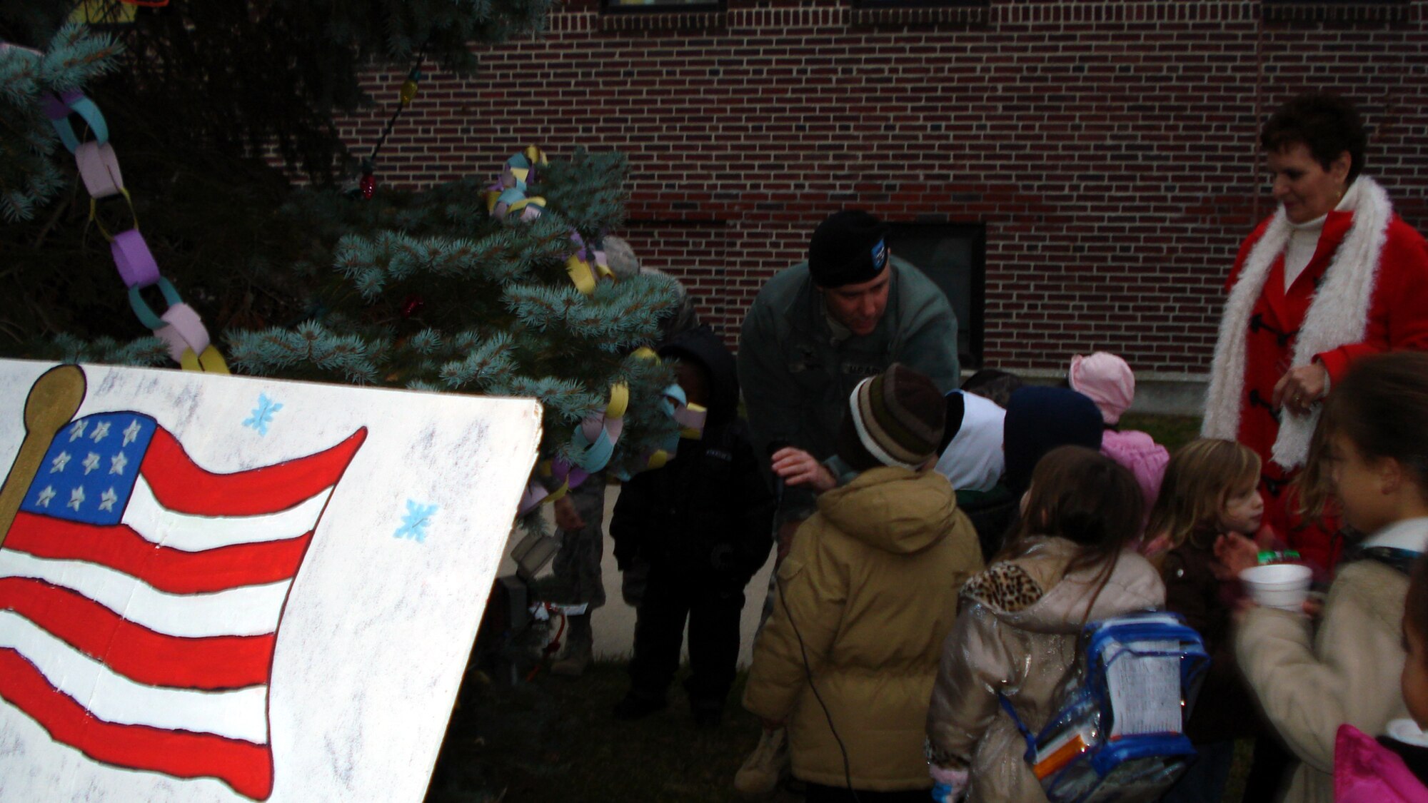 Army Col. Joseph Poth, Joint Base McGuire-Dix-Lakehurst deputy commander,  shares the holiday spirit with children and family members at the Lakehurst tree lighting ceremony, Dec. 2. (courtesy photo)