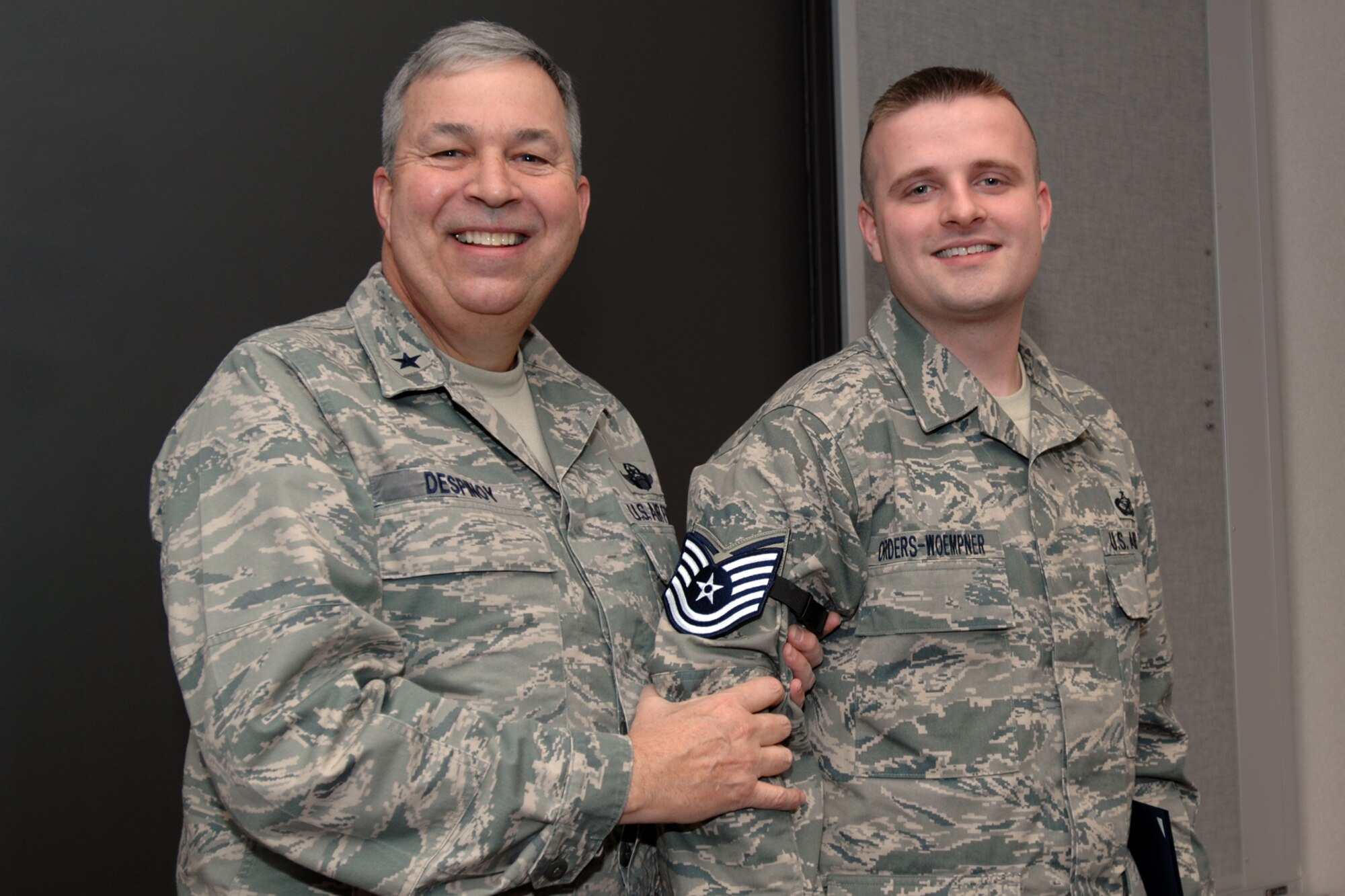 GRISSOM AIR RESERVE BASE, Ind., -- Brig. Gen. Dean Despinoy, 434th Air Refueling Wing commander, pins technical sergeant stripes on  Mark Orders-Woempner, public affairs craftsman, during a wing staff commander's call held on the December unit training assembly.  (U.S. Air Force photo/Tech. Sgt. Doug Hays)
