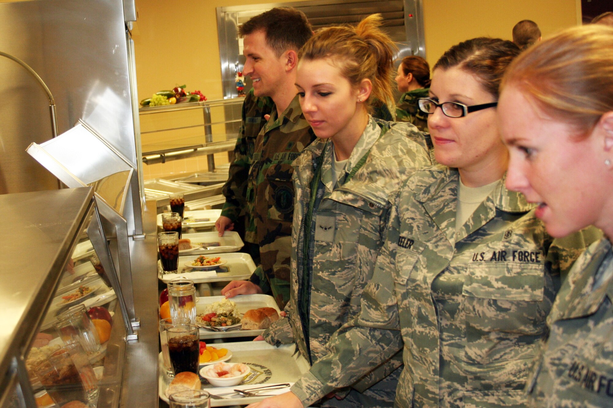 GRISSOM AIR RESERVE BASE, Ind., -- Airmen from the 434th Air Refueling Wing wait to be served lunch on the December unit training assembly. Grissom commanders, chiefs and first sergeants served a holiday meal at the dining facility.   (U.S. Air Force photo/Staff Sgt. Chris Bolen)
