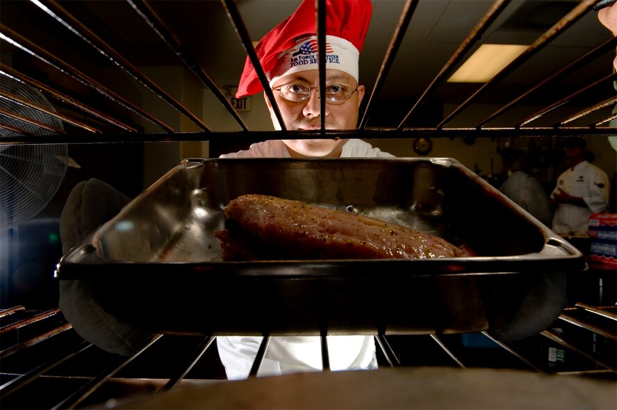 Raised in a restaurant and now tantalizing taste buds as a career, this Airman knows his way around a room full of hazards ... the kitchen. (photo by Tech. Sgt. Matthew Hannen)