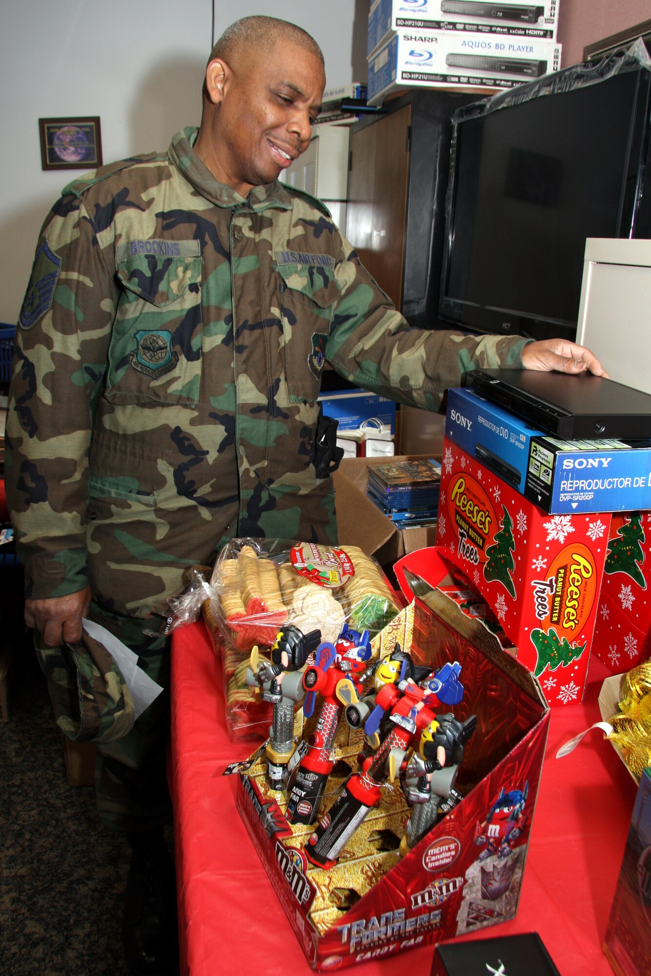 GRISSOM AIR RESERVE BASE, Ind. --  Doing some holiday shopping, Master Sgt. Clarence Brookins checks out a DVD player at the Grissom Base Exchange Christmas store. Sergeant Brookins is a personnel specialist with the 434th Maintenance Squadron. The Christmas store is open through the December alternate unit training assembly and offers a variety of gifts for purchase. (U.S. Air Force photo/Tech. Sgt. Mark Orders-Woempner)