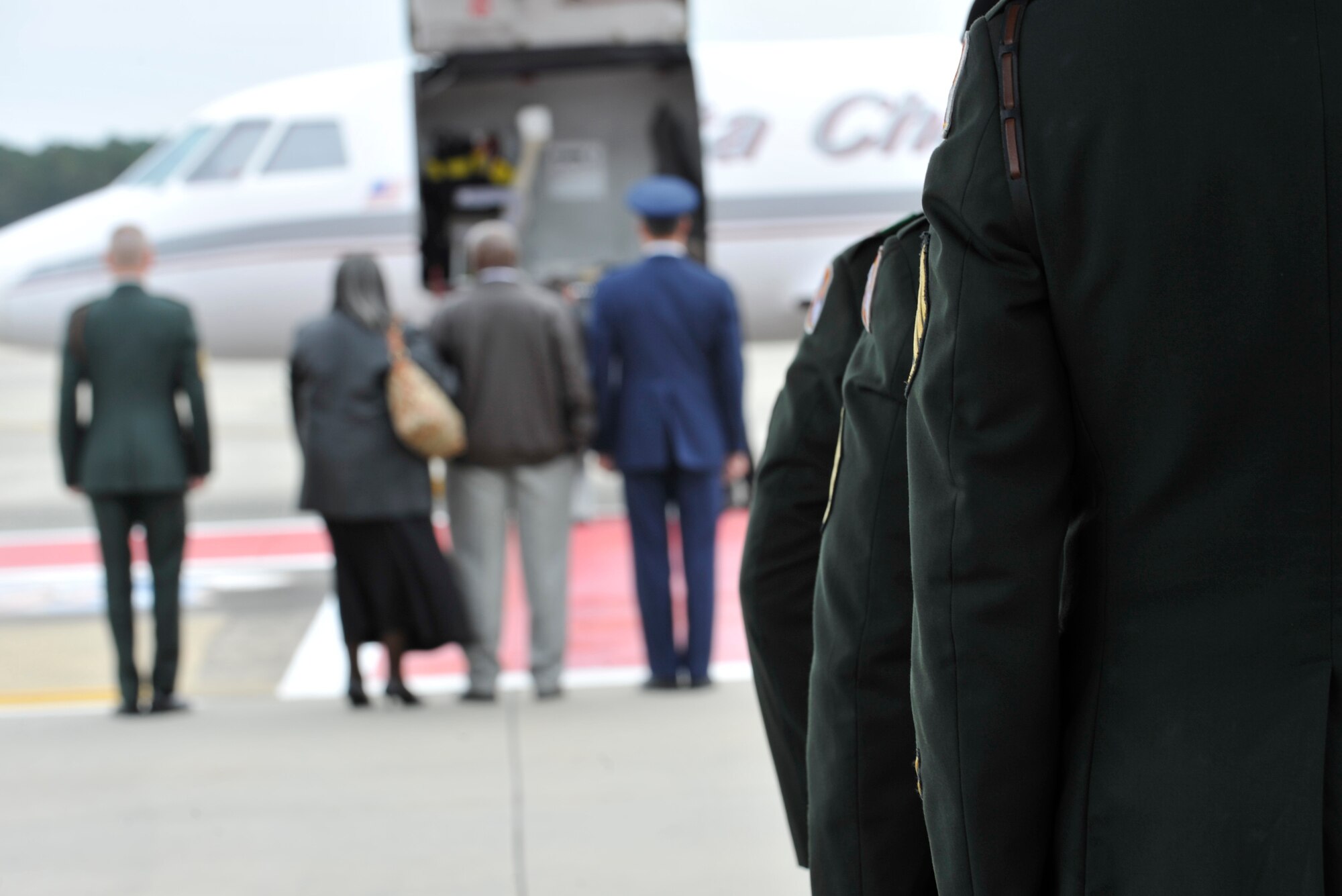 Members of the 198th Infantry Honor Guard from Fort Benning, Ga., begin to march toward an aircraft that is carrying Army Staff Sgt. Briand Williams, a fallen Soldier, Dec. 3, 2009, at Moody Air Force Base, Ga. Sergeant Williams is from Sparks, Ga., and served in the Army since June 2002. (U.S. Air Force photo/Staff Sgt. Schelli Jones)