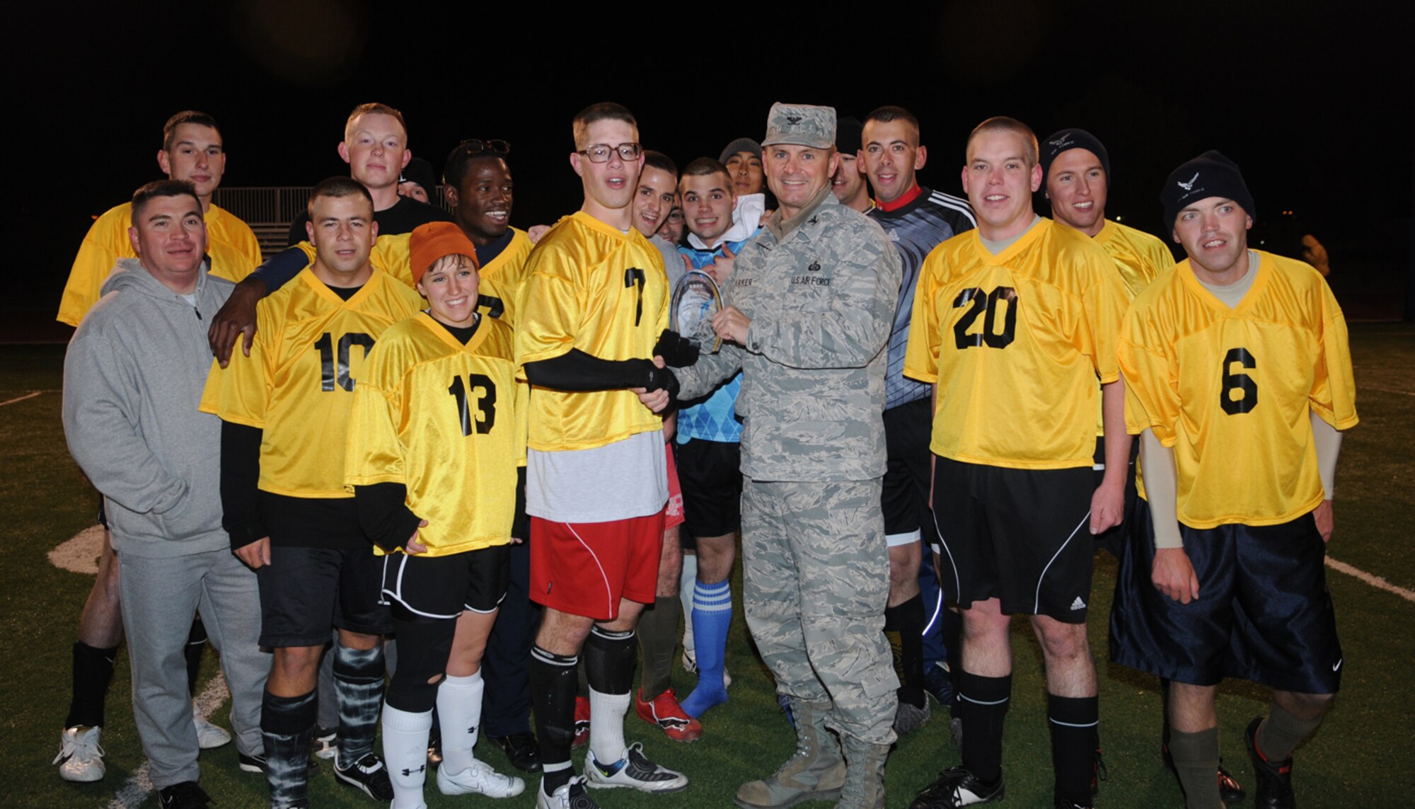 GOODFELLOW AIR FORCE BASE, Texas -- Col. Guy Parker, 17th Mission Support Group commander, presents the 2nd place award to the 315th Training Squadron Sidewinders at the football field, Dec. 3, 2009. The final score was 2-1. (U.S. Air Force photo/Airman Clayton Lenhardt)