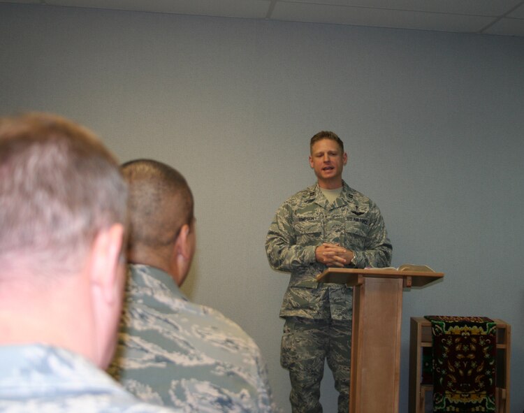 WRIGHT-PATTERSON AIR FORCE BASE, Ohio – Chaplain (Captain) Matthew Simpson, 445th Airlift Wing Chaplain’s office, delivers a message from the Bible while conducting the Second Advent service for wing members during the unit training assembly Dec. 6. Chaplains are available during both UTA’s. The 445th AW Chaplains office is located in Building 4010 room 149 or by phone 937-257-0589. (U.S. Air Force photo/Capt. Rod McNany)