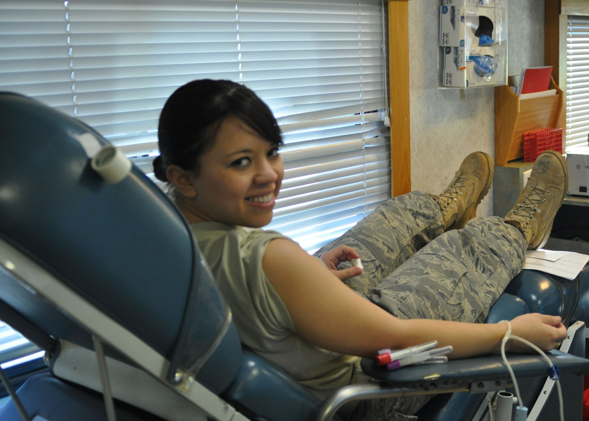 Airman Basic Janira Buitron, a travel management technician for the 917th Wing on Barksdale Air Force Base, La., takes time to smile for a photo during a LifeShare Blood Centers on-base blood drive December 6, 2009 in the parking lot of the 917th Headquarters building. Airman Buitron was one of more than 20 Airmen who donated one of the world’s most precious resources: blood. LifeShare transfuses over 160,000 units of blood products to more than 80 hospitals in their service area. (U.S. Air Force photo/Senior Airman Crystal Jordan)