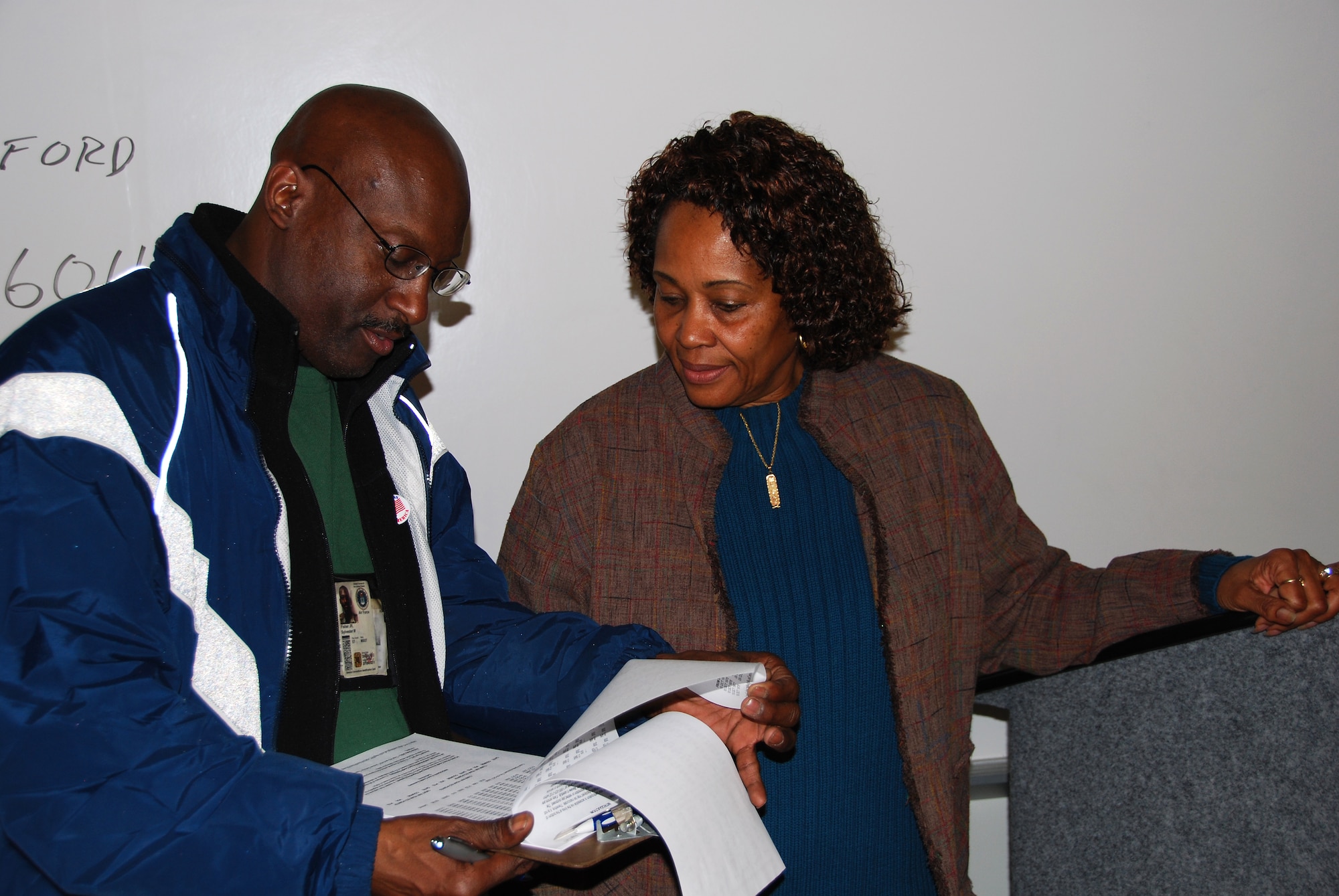 JOINT BASE MCGUIRE-DIX-LAKEHURST, N.J. -- Master Sgt. Sylvester Fisher discusses his retirement pay with Fay Marshall-Dease, a retirement services officer, at the Joint Reserve and Guard Retirement Benefits Seminar Dec. 5 at the Timmermann Center on Joint Base McGuire-Dix-Lakehurst, NJ. The seminar was held to help reserve component members understand many of the details associated with retirement. Master Sgt. Fisher is a member of the 111th Communication Flight of the Pennsylvania Air National Guard. (U.S. Air Force photo/Staff Sgt. Shawn J. Jones)
