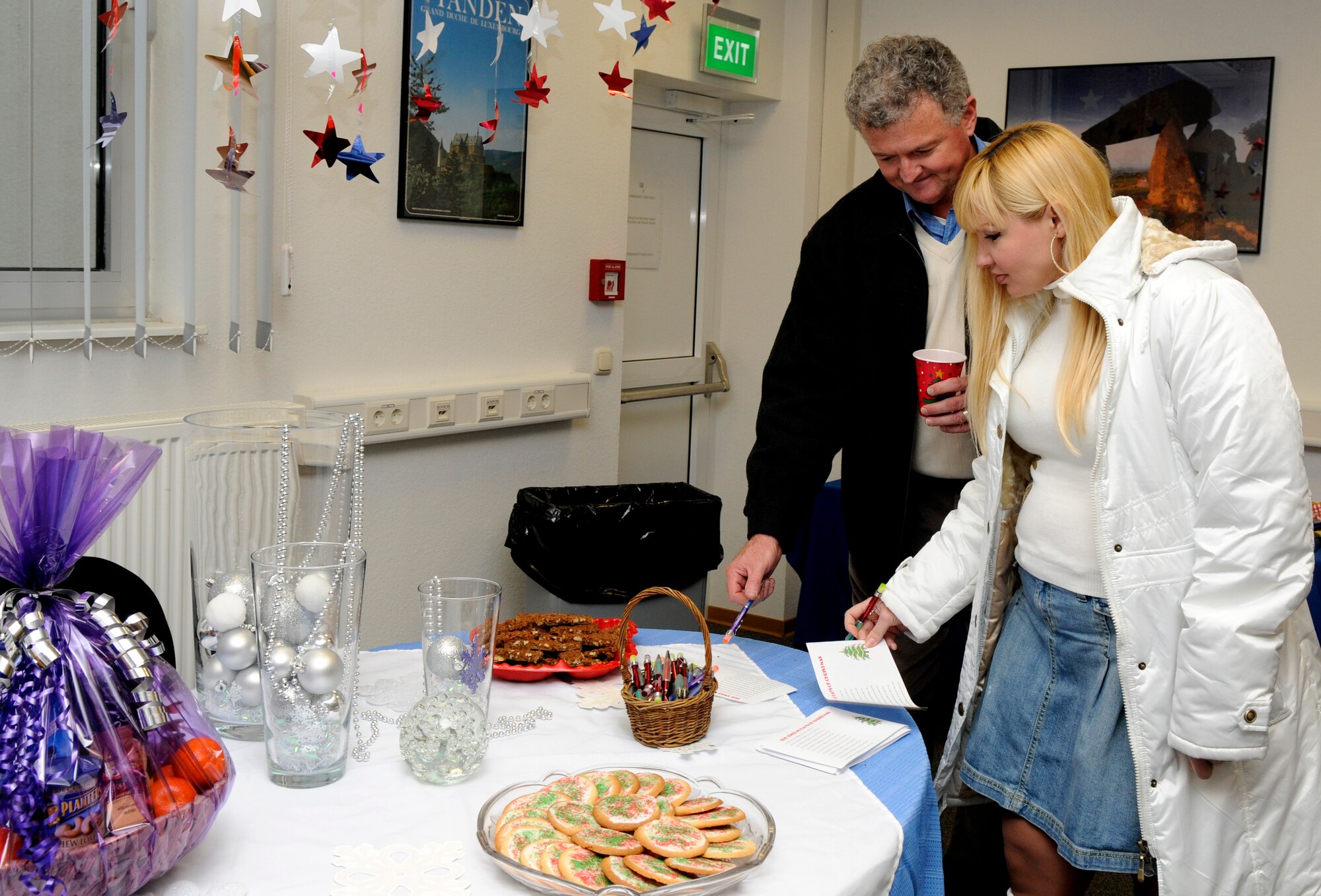 SPANGDAHLEM AIR BASE, Germany – Woody Wilson, 52nd Force Support Squadron, and wife, Sveta, participate in holiday games Dec. 4 at the Airman & Family Readiness Center open house. The holiday open house offered Sabers A&FRC information, holiday food and prizes. (U.S. Air Force photo/Airman 1st Class Staci Miller)