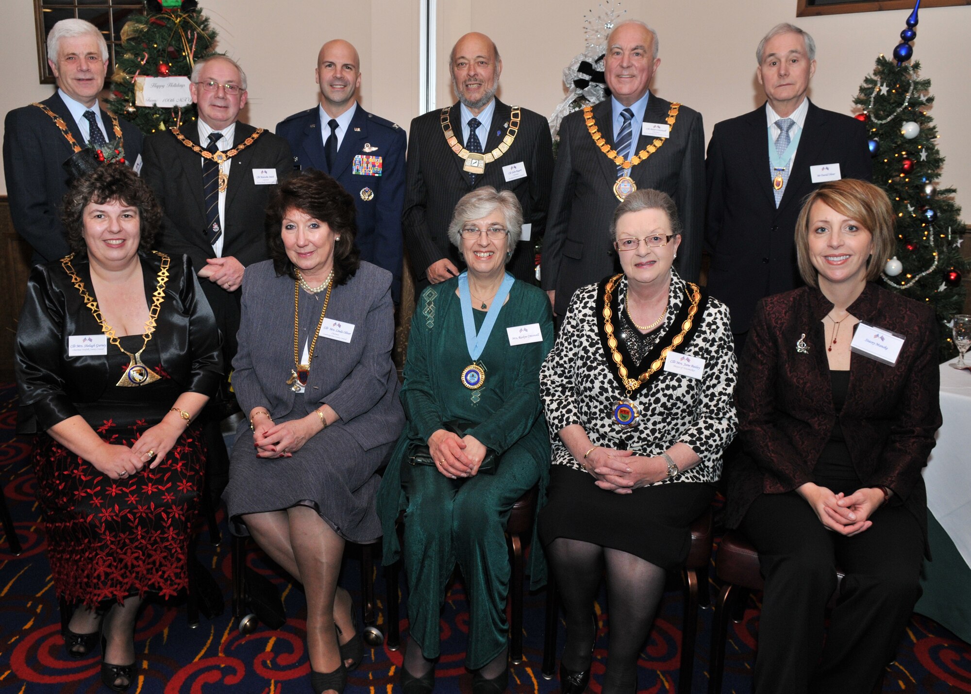 County councillors, area mayors and dozens of other distinguished visitors met with base leadership at RAF Mildenhall for an annual Yuletide reception held at The Galaxy Club Dec. 4. Front row (left to right) was Cllr. Shelagh Gurney, Norfolk County Council chairman; Cllr. Linda Oliver, Cambridgeshire County Council chairman; Roslyn Cresswell, East Cambs District Council mayoress; Cllr. Jane Bailey, Newmarket mayor; and Stacey Manske, RAF Mildenhall Officer Spouse’s Club member and wife of Col. Chad Manske, 100th Air Refueling Wing commander. Back row (left to right) was Cllr. Brian Sulman, Mildenhall Parish Council chairman; Cllr. Malcolm Smith, Forest Heath District Council chairman; Colonel Manske; Cllr. John Rogers, Breckland District Council chairman; Cllr. Peter Cresswell, East Cambs District Council chairman; and David Oliver, Cambridgeshire County Council consort. (U.S. Air Force photo/Tech. Sgt. Kevin Wallace)