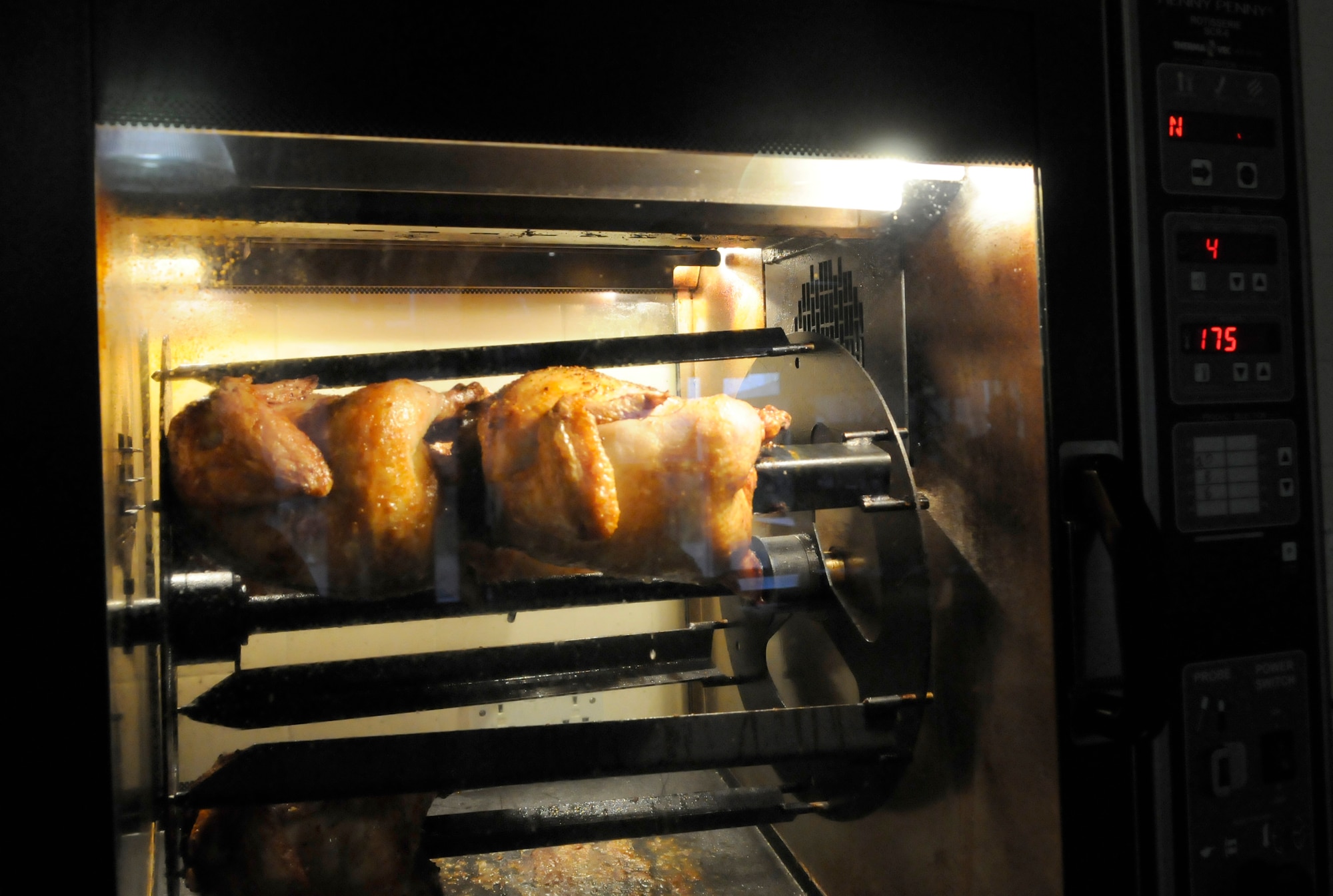 RAF MILDENHALL, England -- The new rotisserie chicken cooker at the Galaxy Club offers a healthier alternative to fried chicken for the base population.  The cooker was purchased after a recommendation was approved through an Air Force Smart Operations for the 21st Century survey.  (U.S. Air Force photo/Staff Sgt. Christopher L. Ingersoll)