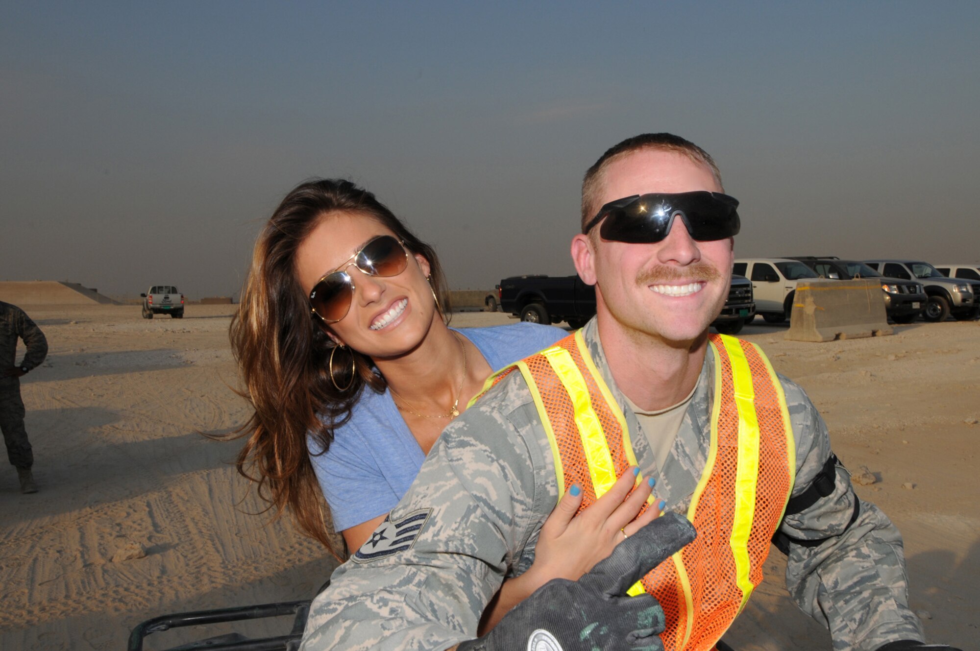 Singer, songwriter Jessie James visits with Staff Sgt. Aaron Burnley, 379th Expeditionary Civil Engineer Squadron, during a tour of the 379th Air Expeditionary Wing, Dec. 5, 2009. Tour for Troops 2009 will visit various deployed locations throughout Southwest Asia and Europe and is sponsored by the U.S. Air Force Reserve Command. (US Air Force Photo/Tech. Sgt. Jason Edwards)