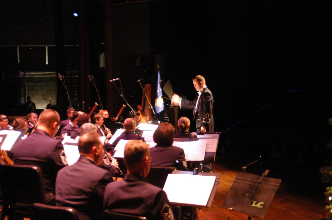 Second Lieutenant Jason Plosch leads the USAF Academy Band Concert Band in a spirited holiday performance at the Lincoln Center in Ft. Collins, CO.
