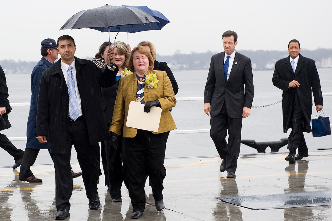 Becky Gates, wife of Defense Secretary Robert M. Gates is escorted to her seat during the christening ceremony of the USS Missouri in Groton, Conn., Dec. 5, 2009.  Becky Gates is the sponsor of the Missouri, the Navy's newest Virginia-class submarine.  