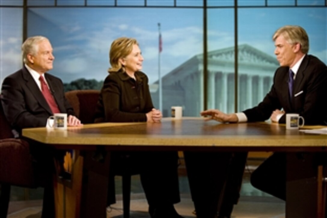 Defense Secretary Robert M. Gates and Secretary of State Hillary Rodham Clinton talk with NBC's "Meet the Press" host David Gregory in Washington, D.C., Dec. 5, 2009. This was the first time the two cabinet members appeared together on Sunday morning talk shows and their interviews were taped Saturday evening.