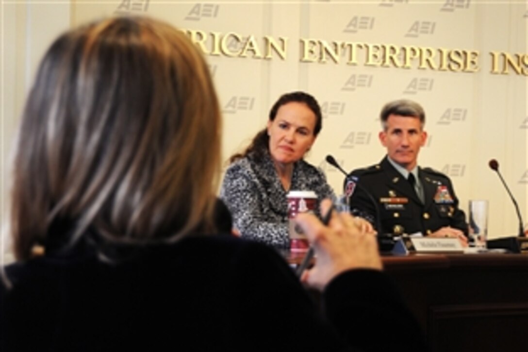 Michele Flournoy, under secretary of defense for policy, left, and U.S. Army Brig. Gen. John Nicholson, Joint Staff's director of the Pakistan-Afghanistan coordination cell, listen to questions during an appearance at the American Enterprise Institute in Washington, D.C., Dec. 7, 2009. Questions focused on the new Afghanistan stratagy and the implications for the United States and NATO coalition.