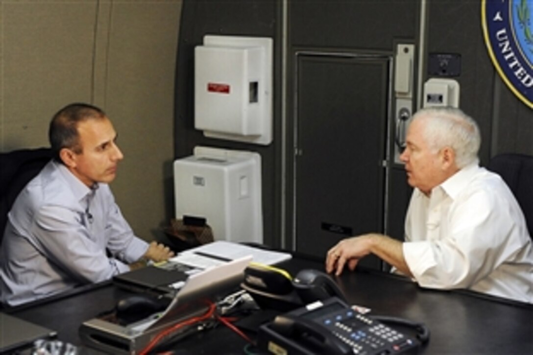 Defense Secretary Robert M. Gates, right, responds to questions by NBC's "Today" show host Matt Lauer while en route to Kabul, Afghanistan, Dec. 7, 2009. Gates is on his first trip to Southwest Asia following President Barack Obama's decision to send an additional 30,000 troops to the region. 