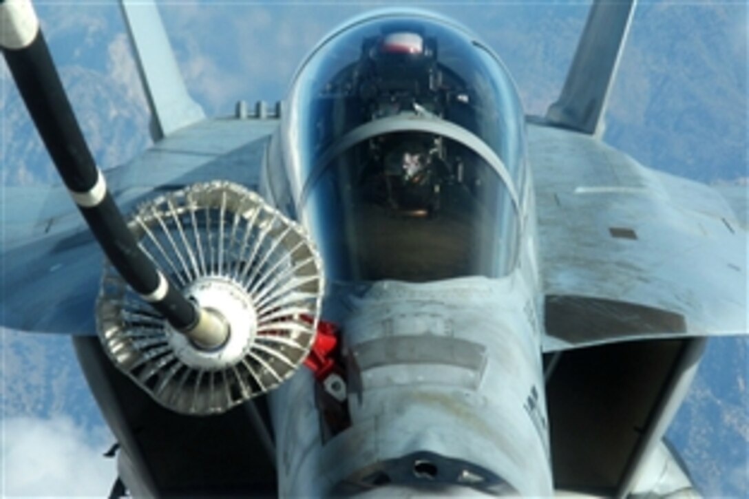 A U.S. Air Force KC-10 Extender aircraft refuels a Navy F/A-18F Super Hornet aircraft over Afghanistan, Dec. 7, 2009. The squadron is part of the Nimitz Carrier Strike Group, which is deployed to the region. The Super Hornet is assigned to Strike Fighter Squadron 41.