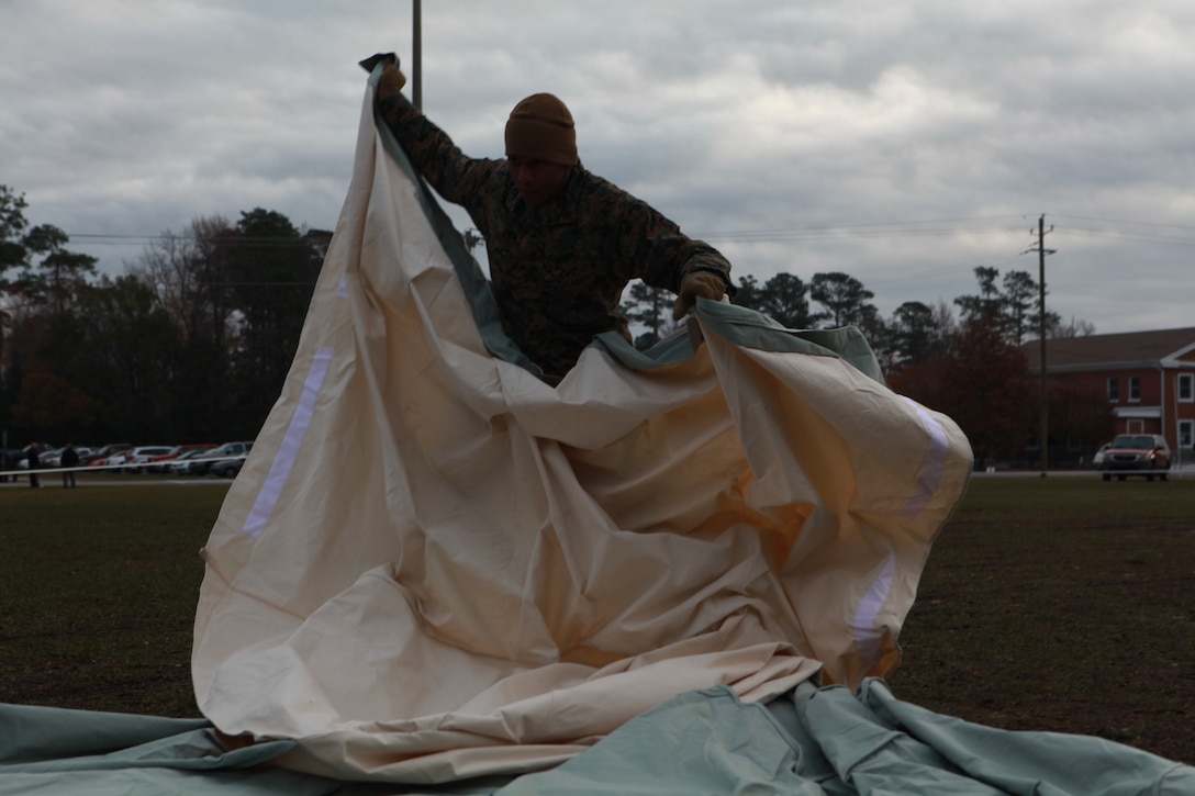 Sgt. Lester Ward from 26th Marine Expeditionary Unit spreads out a cover which houses the balloon portion of the Combat SkySat High Altitude Operations Payload system during a lofted communications exercise aboard Camp Lejeune, NC, Dec . 8, 2009.  By floating relay equipment on a balloon, SkySat can extend the range of military radios from four miles up to hundreds of miles.  (Official Marine Corps photo by Sgt. Danielle M. Bacon)::r::::n:: ::r::::n::