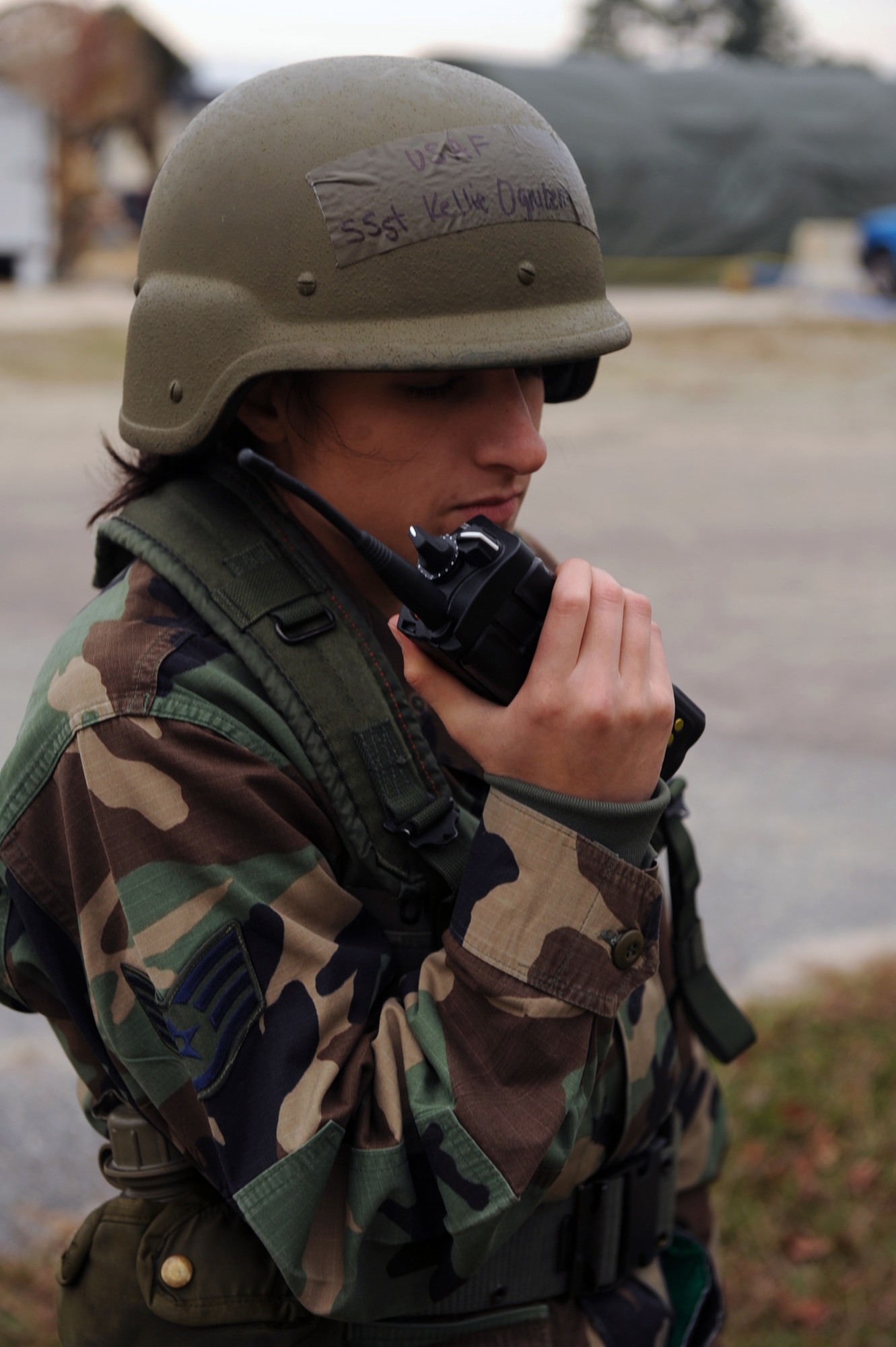 Staff Sgt. Kellie Ognibene, post attack reconnaissance team member, radios in the status of pre-positioned chemical detection paper at Base X, Dec. 8, 2009. A PAR team is sent out after a simulated attack has occurred and are also responsible for checking the paper and determining if a chemical attack has happened. (U.S. Air Force photo/Senior Airman Ciara Wymbs)