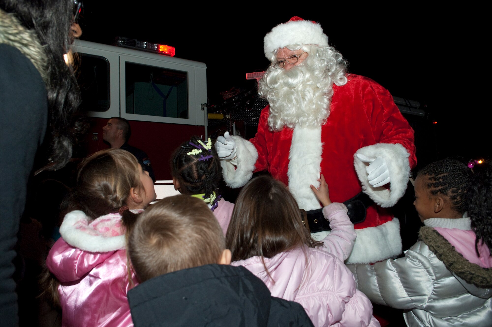 Santa Claus greets Edwards children during the 13th Annual Holiday Tree Lighting ceremony Dec. 2 at the Base Exchange parking lot. The ceremony marks the beginning of holiday season at Edwards. (U.S. Air Force photo/Michael Yncera)