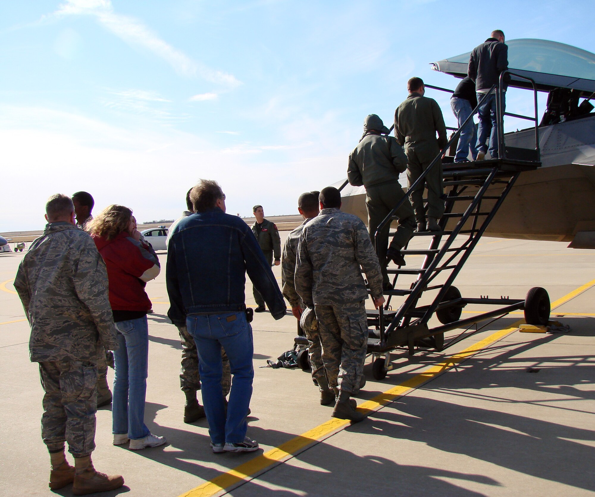 F-22 pilot, Maj. Kevin “Boone” Cruson of the 43rd Fighter Squadron at Tyndall, AFB Fla., provided Team Vance members with a chance to look inside the cockpit when he landed at Vance to refuel Dec. 3. Major Cruson was en route to Tyndall AFB, from Hill AFB, Utah, where the aircraft was in depot maintenance. (U.S. Air Force photo/ 2nd Lt. Chris Buzzetta)