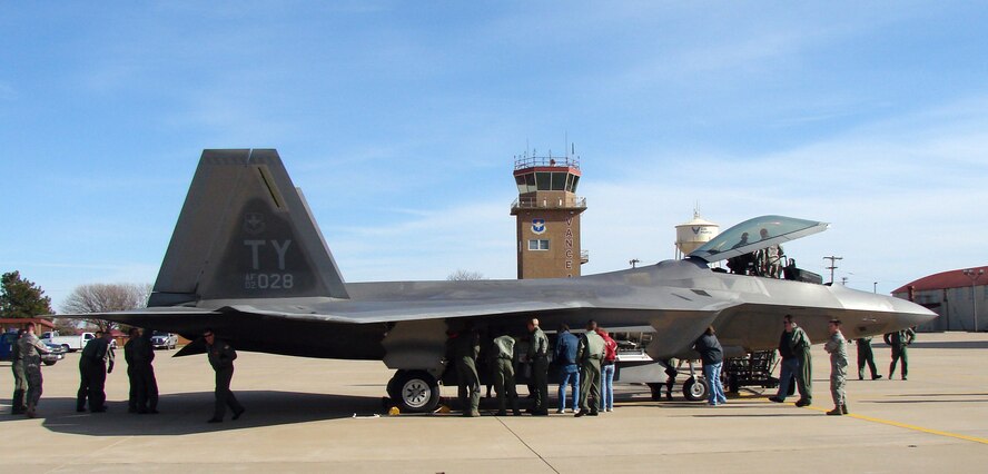 Team Vance members look over an F-22, after refueling, en route to Tyndall, AFB Fla., on Dec. 3. (U.S. Air Force photo/ 2nd Lt. Chris Buzzetta)