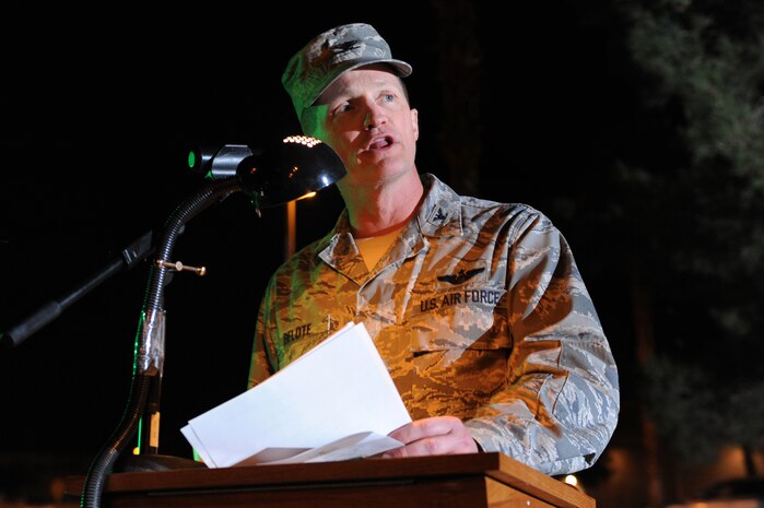 NELLIS AIR FORCE BASE, Nev. - Col. Dave Belote 99th Air Base Wing, commander speaks during Nellis's annual Menorah and Christmas tree lighting ceremony at the Base Chapel Dec. 4.  Airman and their Families  gathered outside the chapel to sing Christmas carols, meet Santa Claus, and celebrate the holiday season.(U.S. Air Force photo by Tech. Sgt. Michael R. Holzworth)