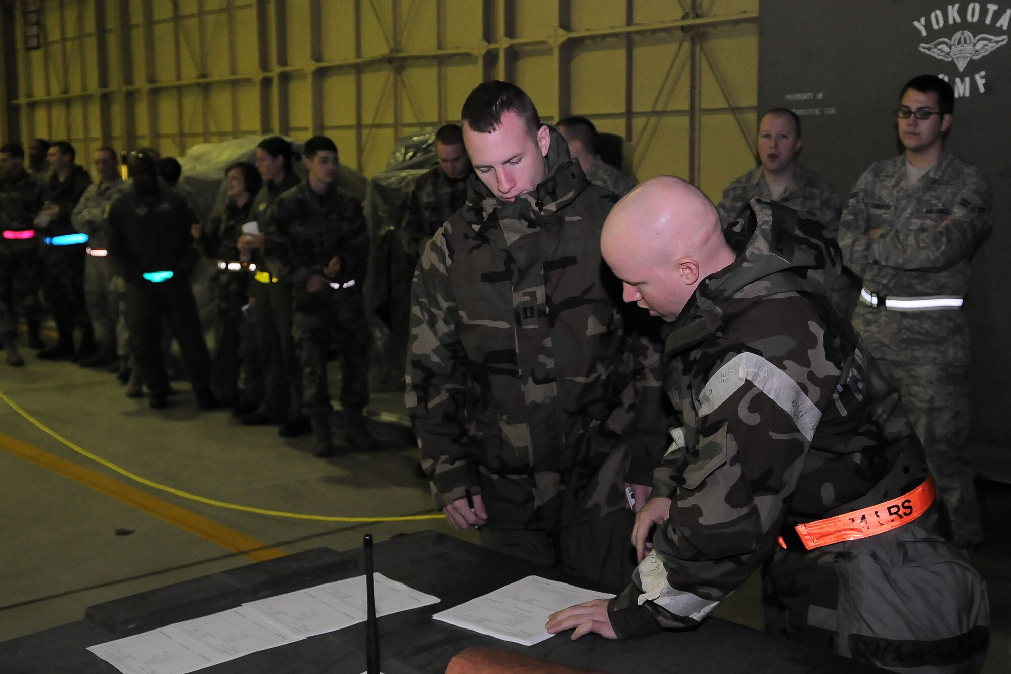 YOKOTA AIR BASE, Japan -- Simulated incoming forces sign in upon their arrival during an operational readiness inspection conducted by the Pacific Air Forces Inspector General. The reception of forces is one of the primary missions of the base during various contingency operations. (U.S. Air Force photo/Airman 1st Class Michael Dillon) 