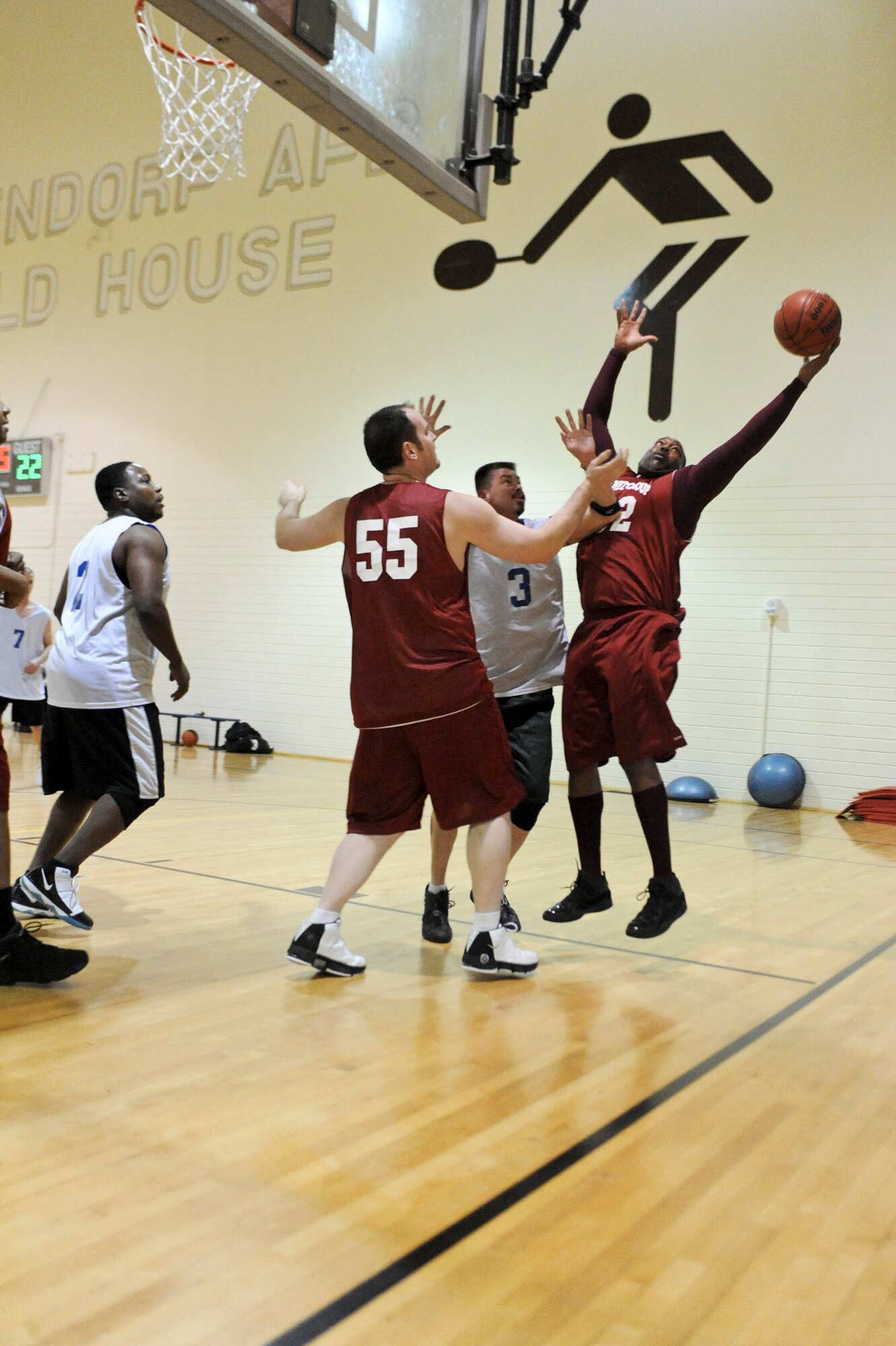 ELMENDORF AIR FORCE, Alaska -- The 3rd Medical Support Squadron's Nathan Hanzy tries to snag a rebound and keep the ball in bounds during a game against the 381st Intelligence Squadron Dec. 7 at the Fitness Center. The 3rd MDSS came out on top 55-39.  (U.S. Air Force photo/Airman 1st Class Christopher Gross)