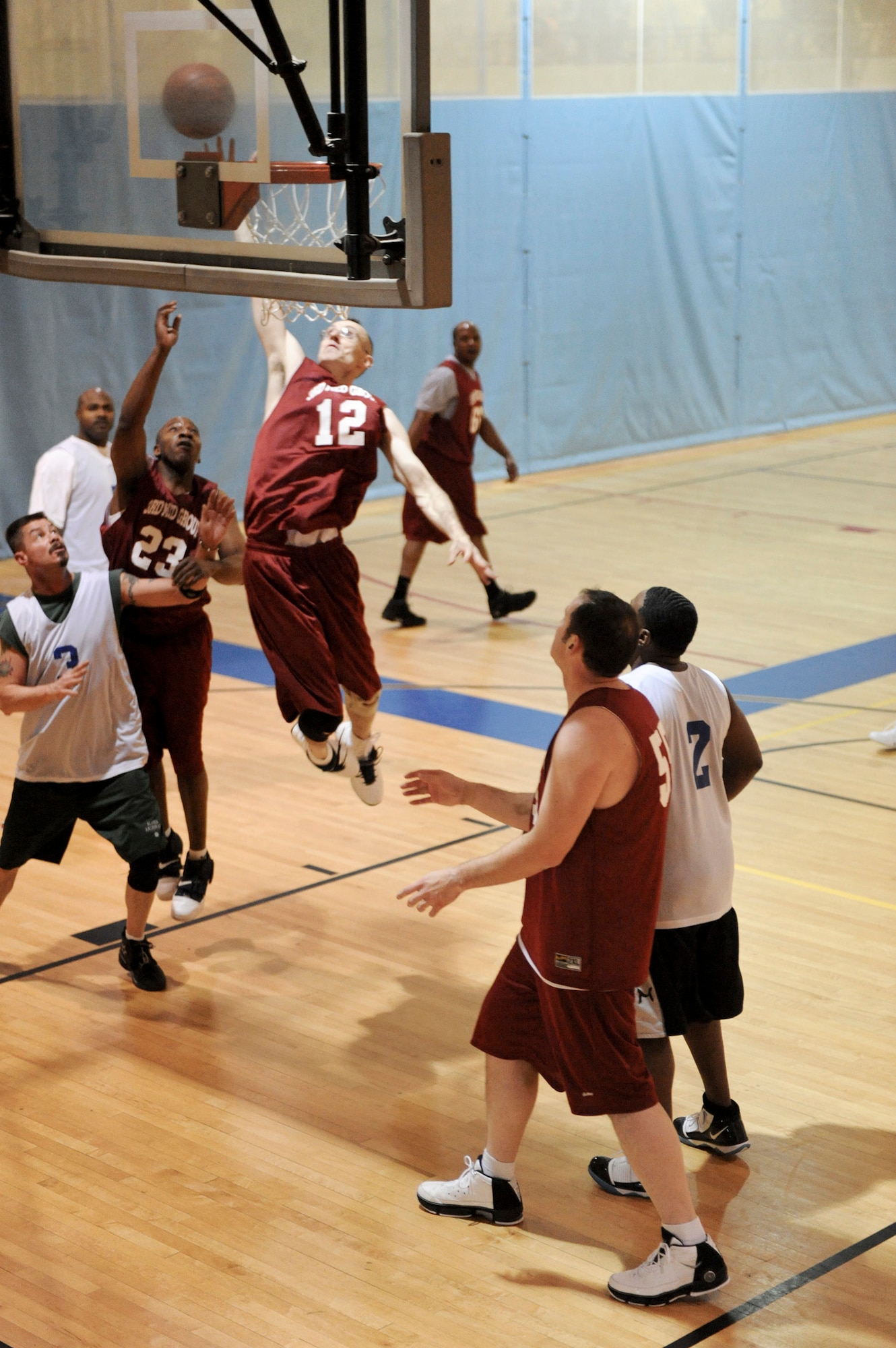 ELMENDORF AIR FORCE, Alaska -- The 3rd Medical Support Squadron's Lee Mills goes in for a layup during a game against the 381st Intelligence Squadron Dec. 7 at the Fitness Center. The 3rd MDSS came out on top with a score of 55-39. (U.S. Air Force photo/Airman 1st Class Christopher Gross)