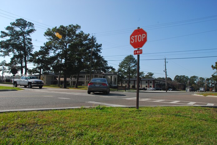 A Chevy Silverado demonstrates a complete stop at a four-way intersection while yielding to a Honda Civic here Dec. 7. It is crucial to abide by the proper traffic laws to ensure continued driving privileges on Charleston AFB. Traffic safety is a shared responsibility between the members of Team Charleston.(U.S. Air Force photo/Airman 1st Class Lauren Laidlaw)